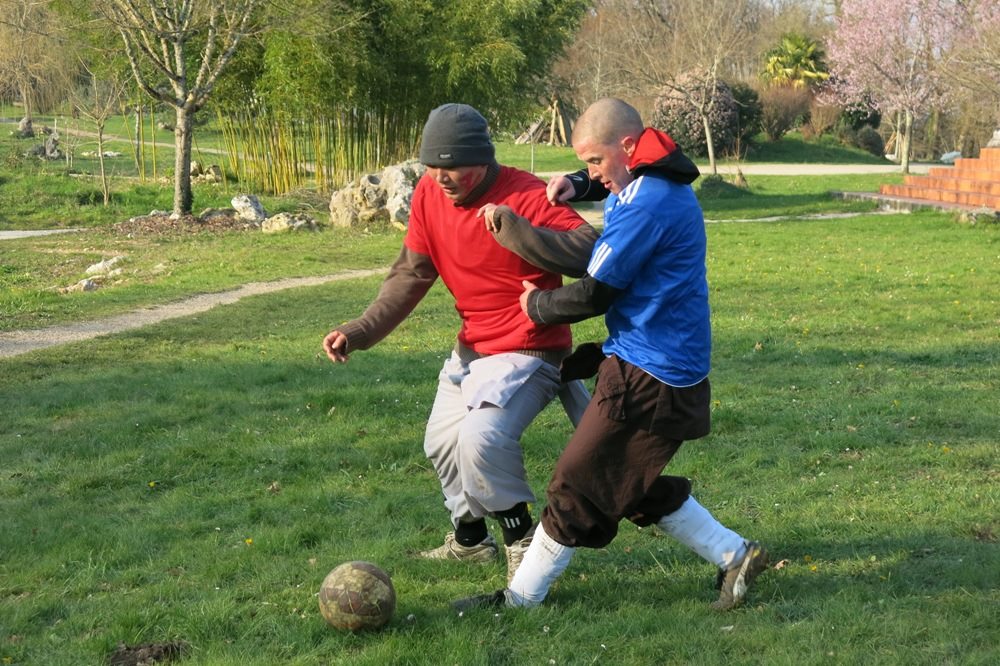 Brother Dao Kien playing football during the monastic retreat